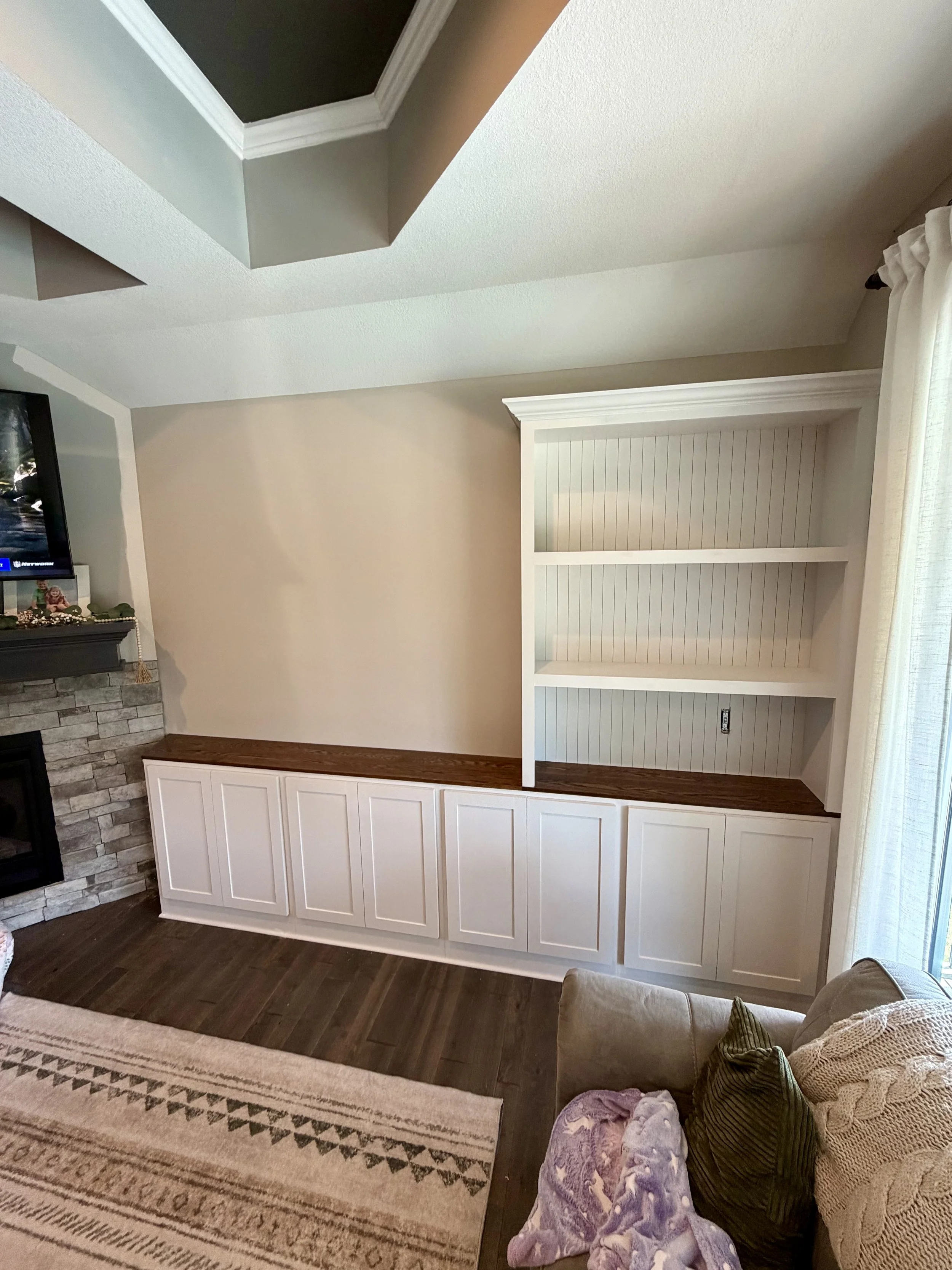 Custom Entertainment Center Built Ins white cabinets and stained oak top