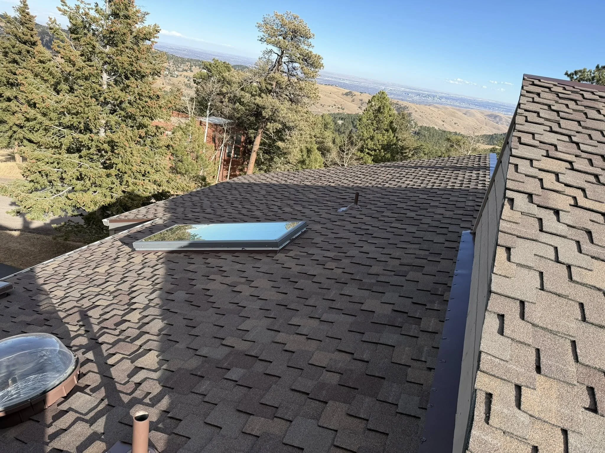 brown shingles on a roof | How to get insurance to pay for roof replacement | Troost Roofing