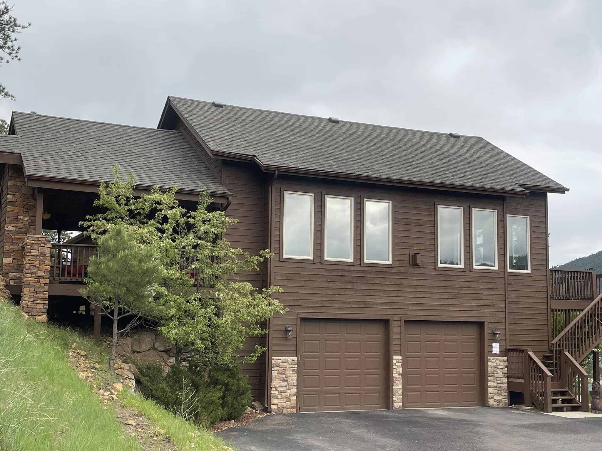 an example of Idaho Springs roofing: a slate brown home with a matching roof.