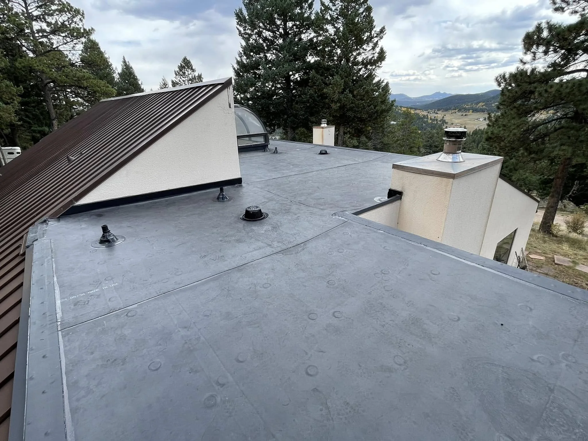 image of an EPDM rubber roof | commercial roofing repair | Troost Roofing