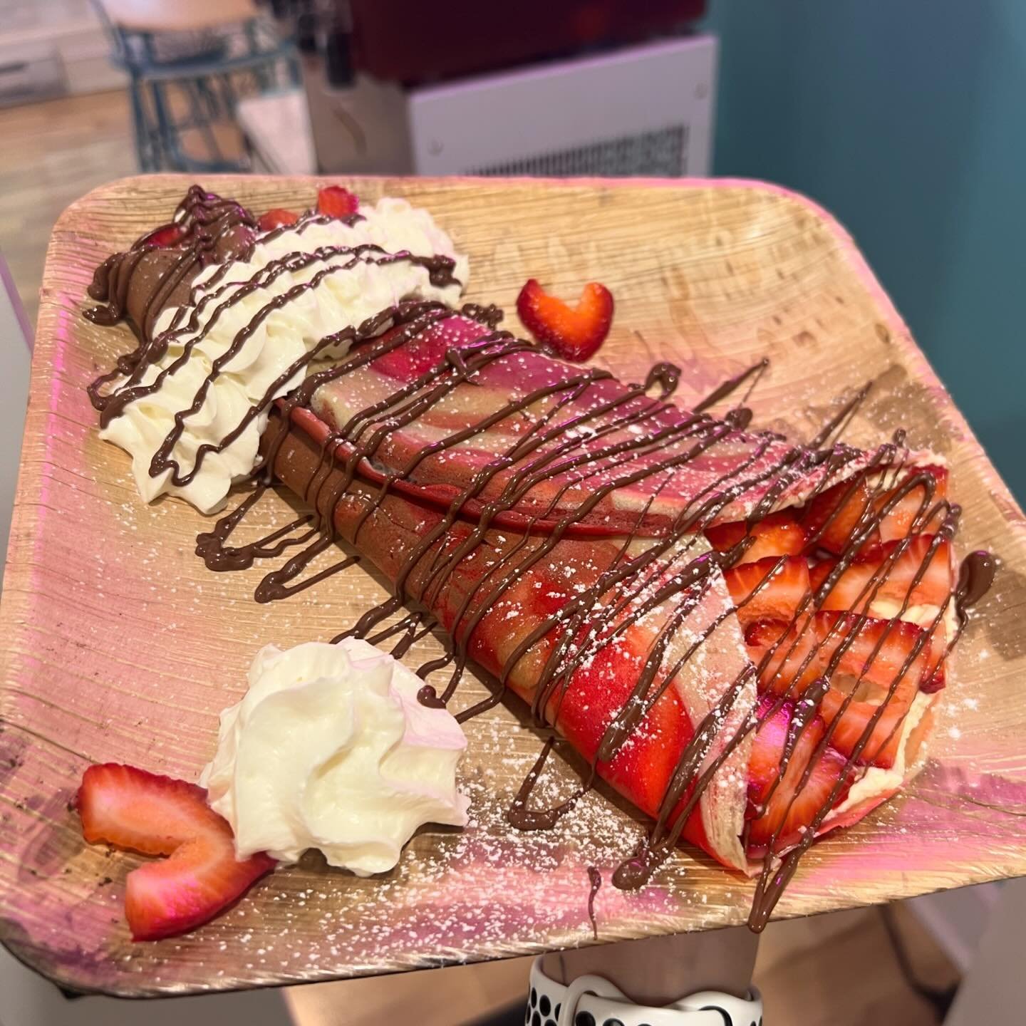 Mothers Day Crepe 🍫🧁💗
&lsquo; I Love My Mom &lsquo;
- Marble crepe stuffed with organic homemade cream cheese whip, strawberries, hugged by whipped cream, powered sugar and nutella drizzle