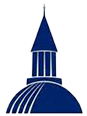 Silhouette of a building with a tall, pointed spire.