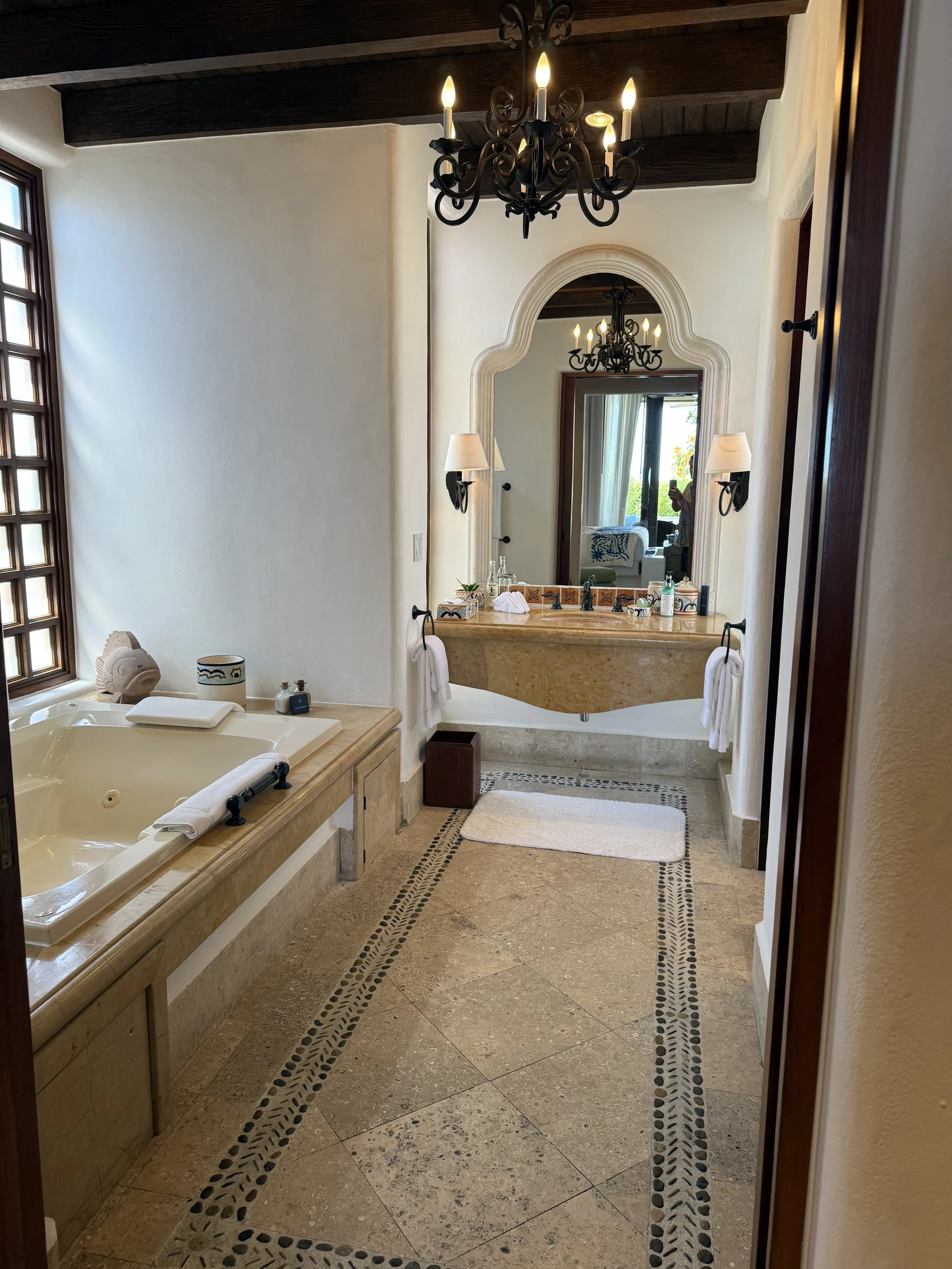 The bathroom, with hand-laid stone accents and soaking tub