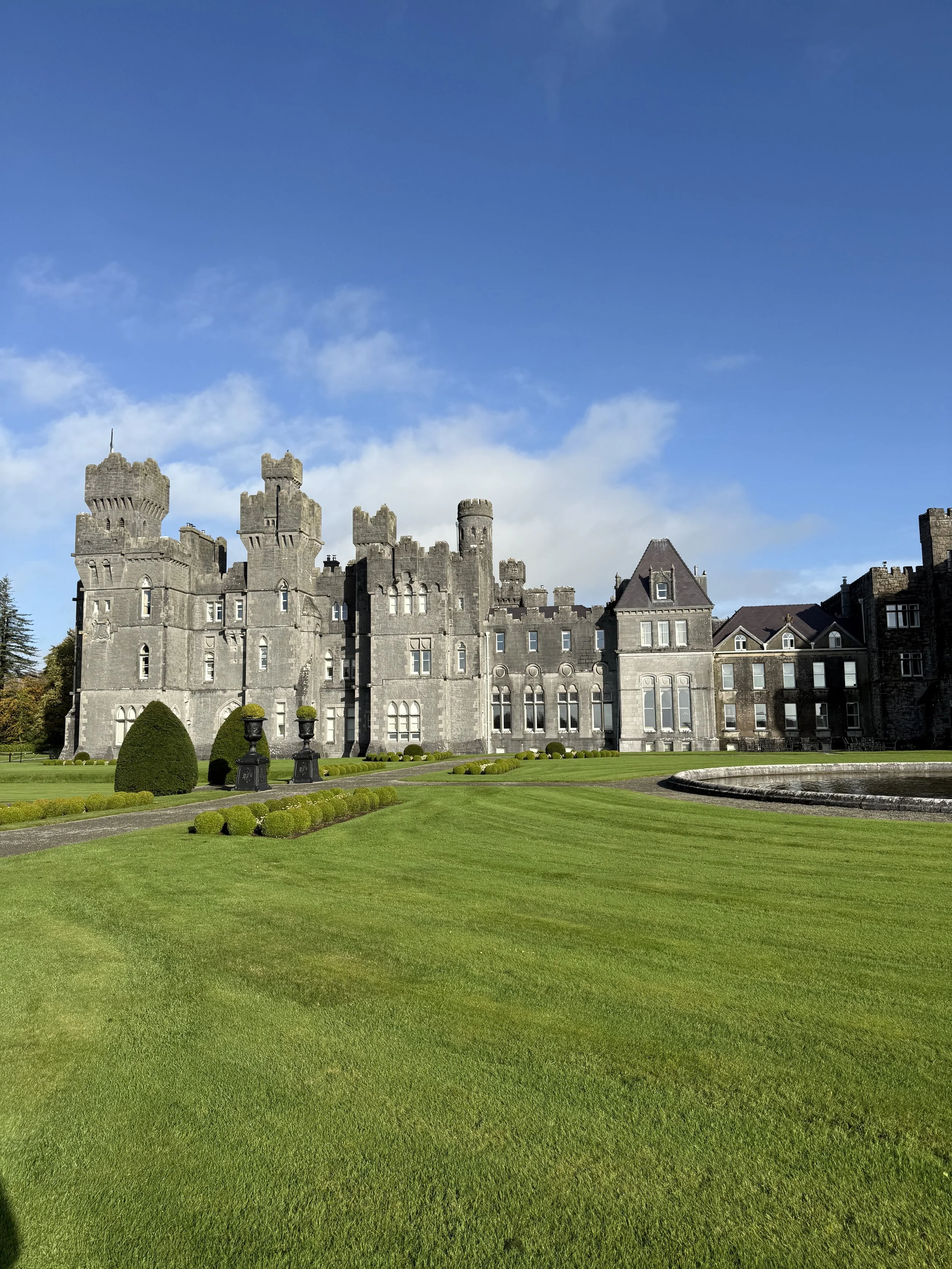 The historic stone facade of Ashford Castle in County Mayo, Ireland