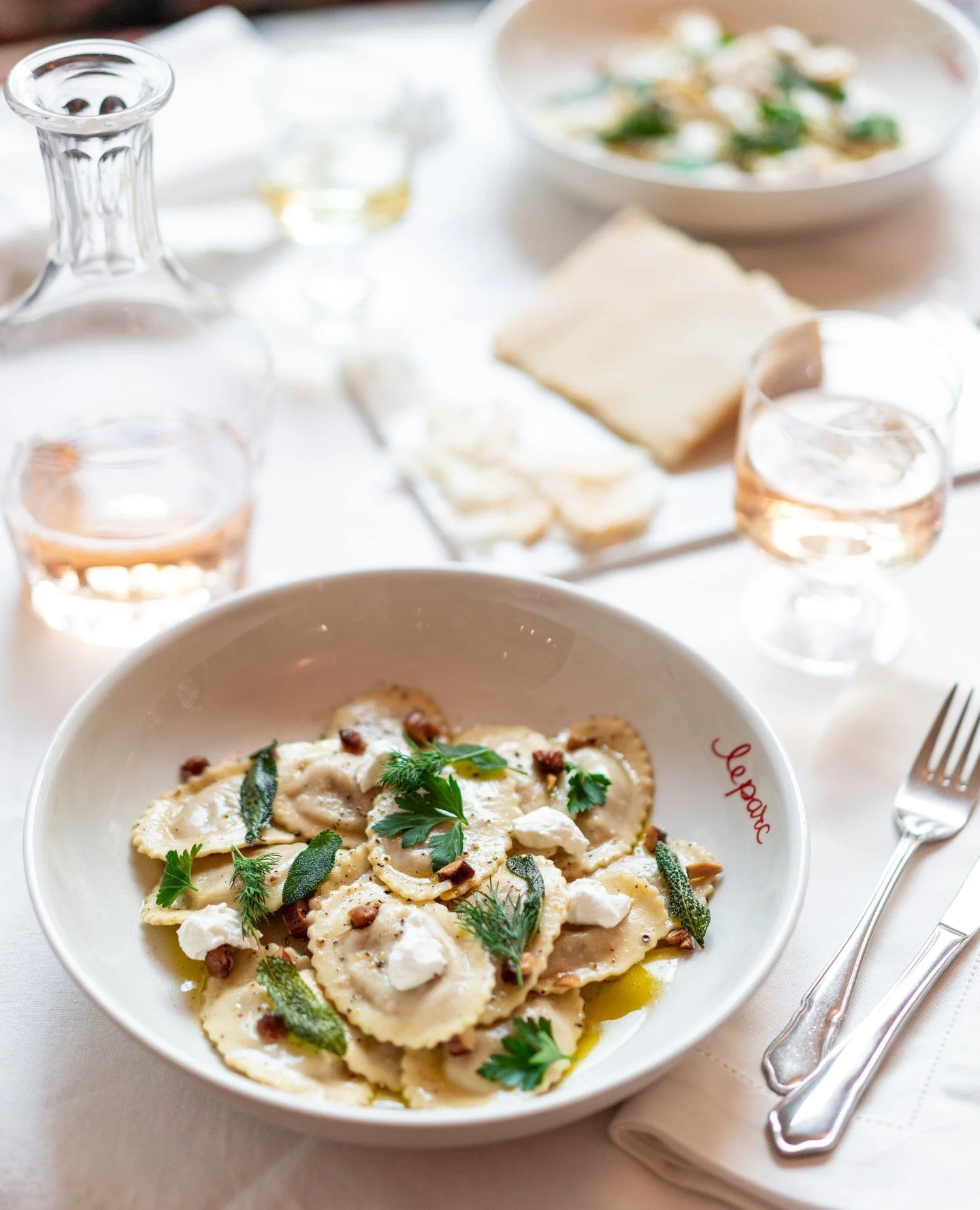 Pillows of winter comfort. Butternut Pansotti tossed in a rich burnt butter sauce, finished with crisped sage, toasted almonds, and creamed feta.⁠
⁠
#butternutpansotti #leparc⁠