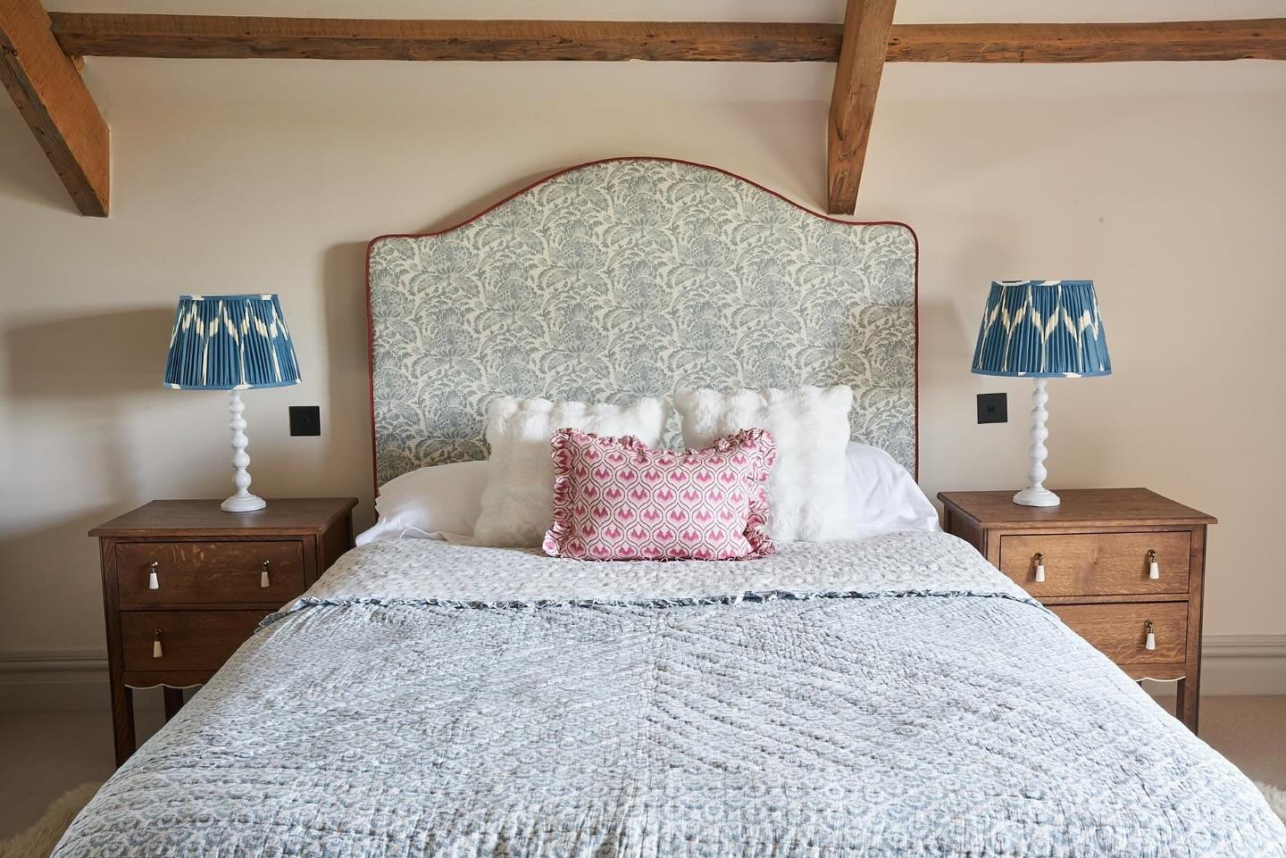A recently completed teenagers bedroom. The large headboard adds softness, pattern and a little nod of joyful colour on a fabulous bespoke design. The challenge came getting it to work with the beautiful old beams of the building but it now fits in b