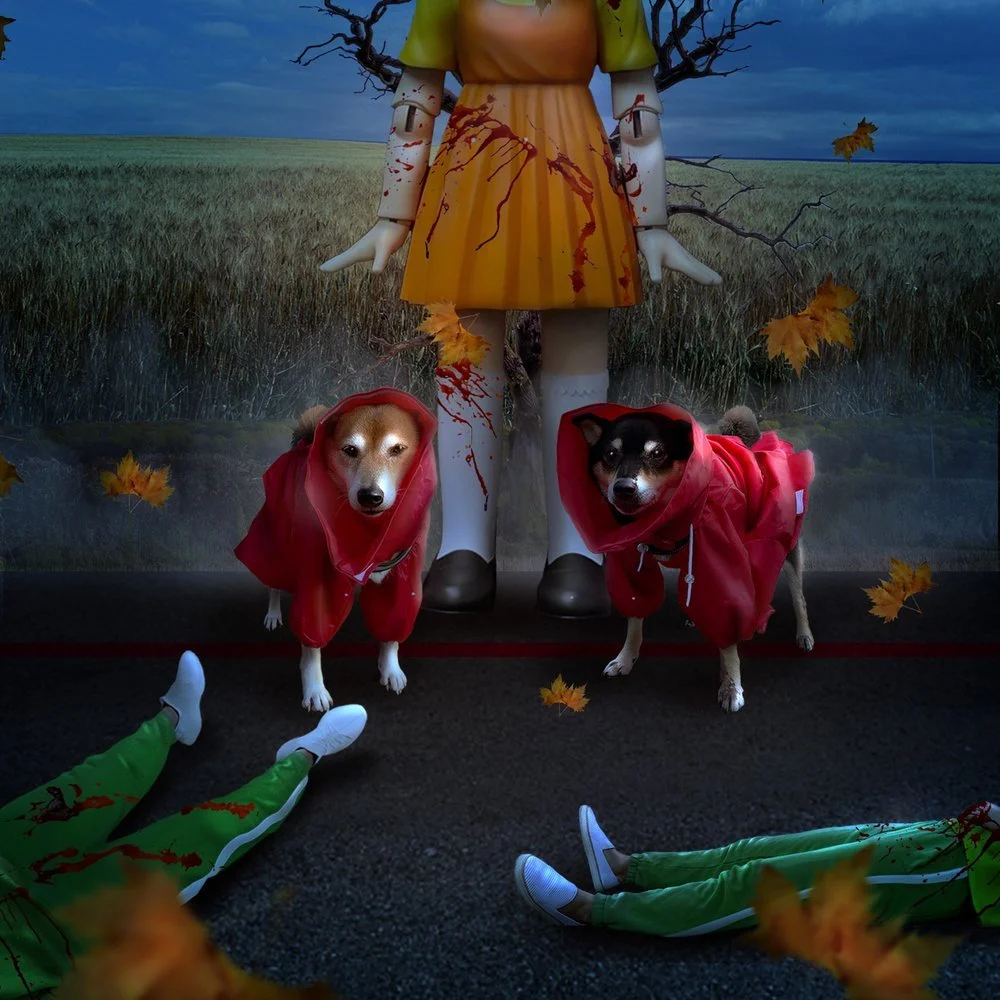 A haunted scene with two dogs dressed as bloodied victims in red raincoats standing in front of a large, creepy doll with bloodstains. The background shows a dark, cloudy sky over a field, with falling autumn leaves, and a person lying on the ground in green pants and white sneakers.
