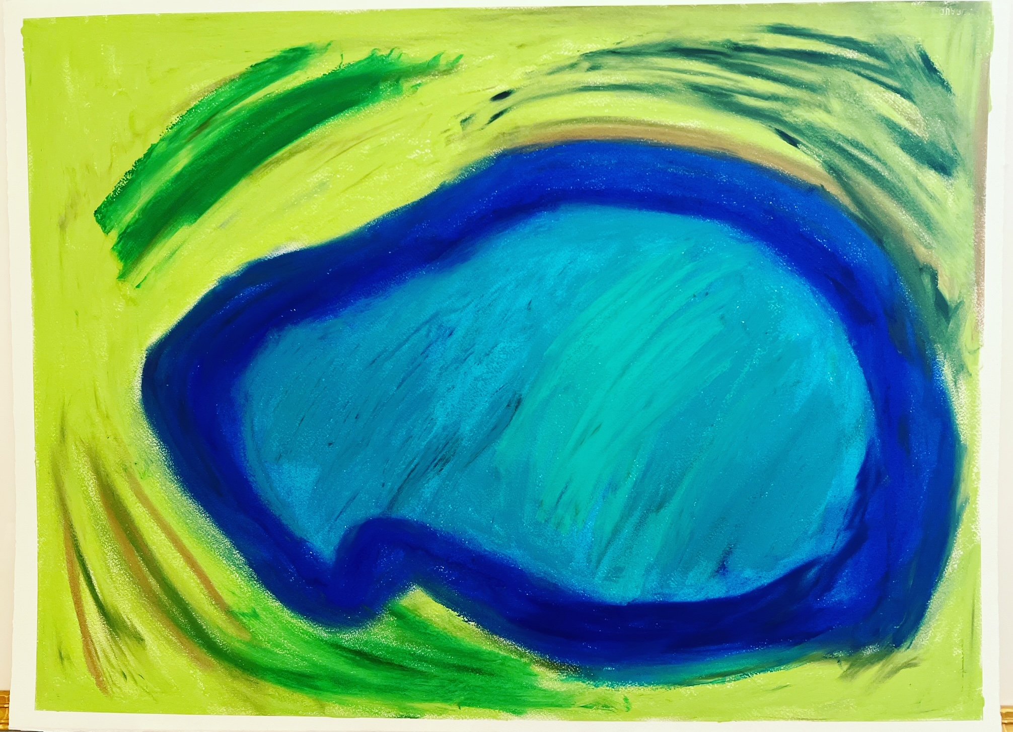 blue pond on a green background