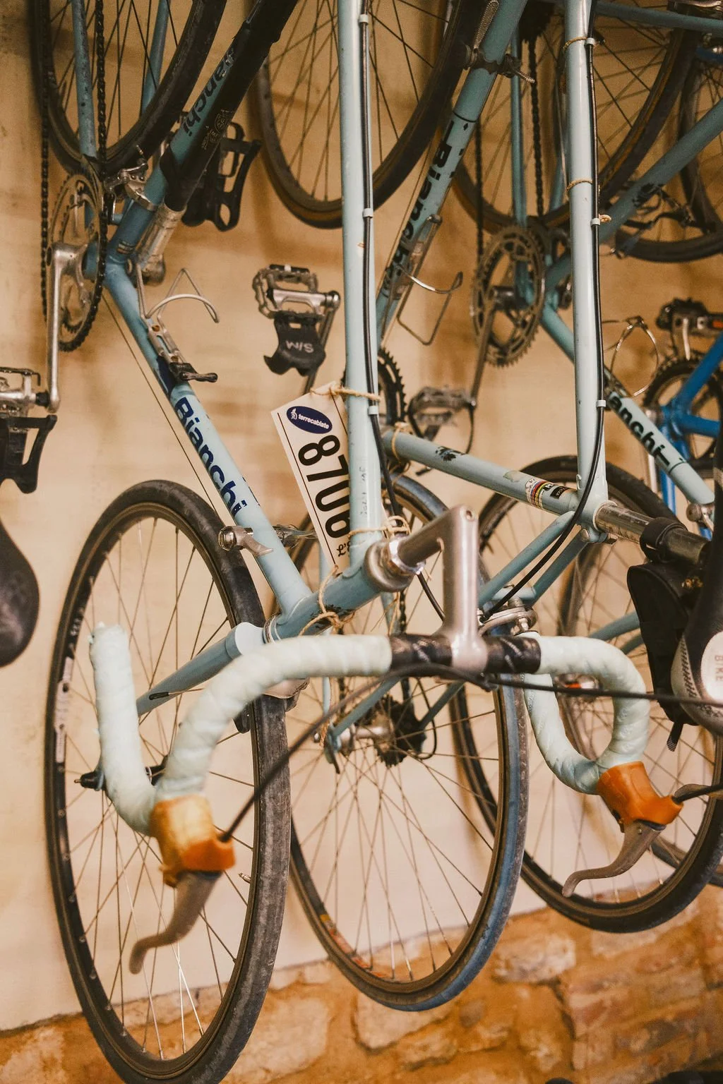Classic Bianchi bikes hanging on wall