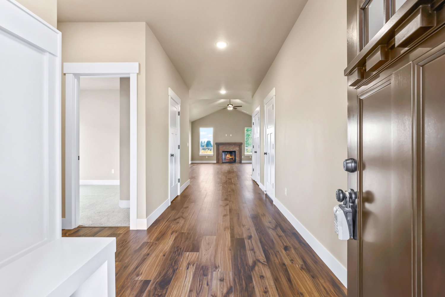 Flooring Calypso Whiskey, Fireplace Brique Cotto, Stained beam with legs, Paint Sherwin Williams Benjamin Moore Blanched Almond #1060, White trim.jpg