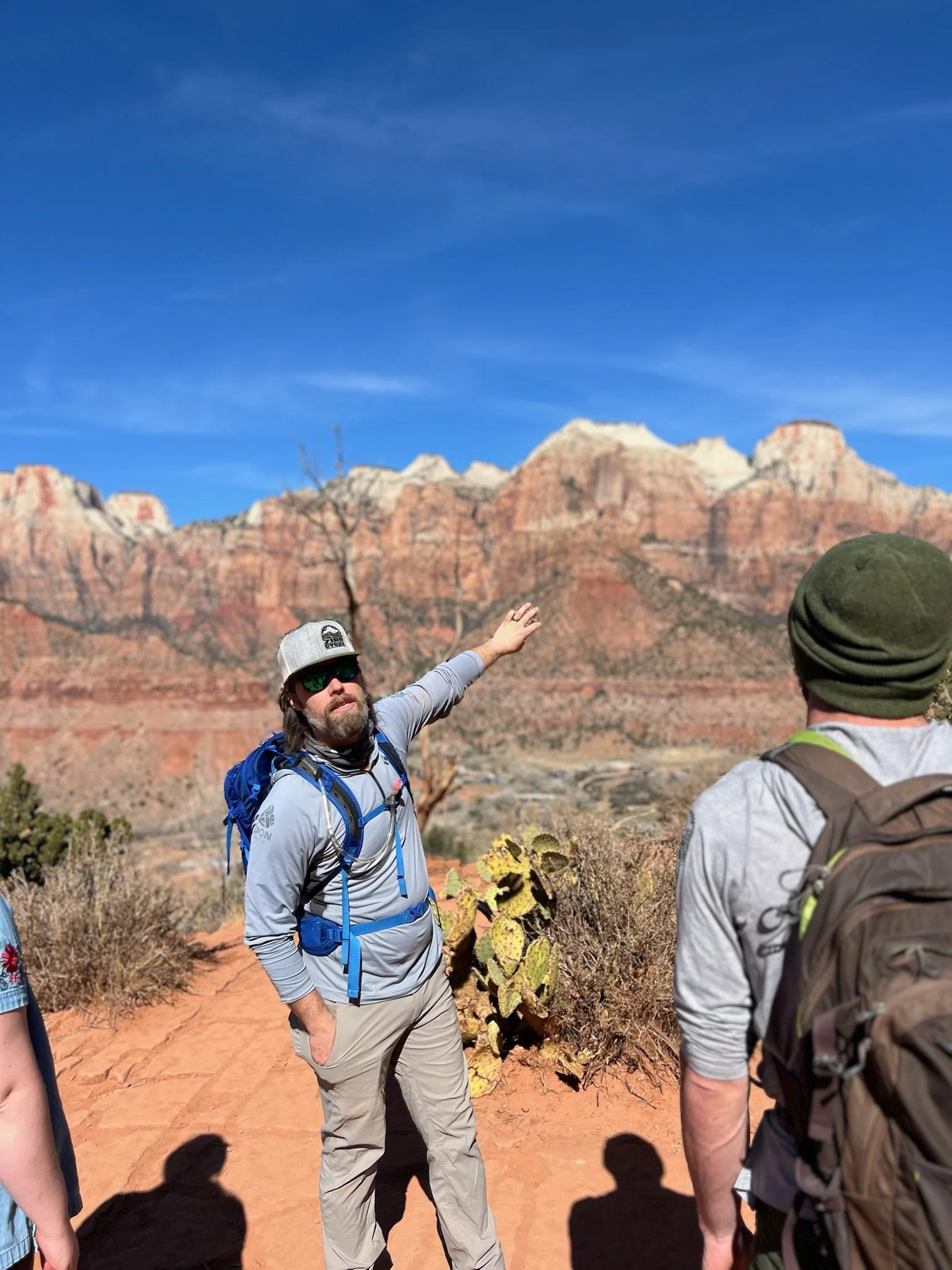 A man standing next to a bike with a helmet