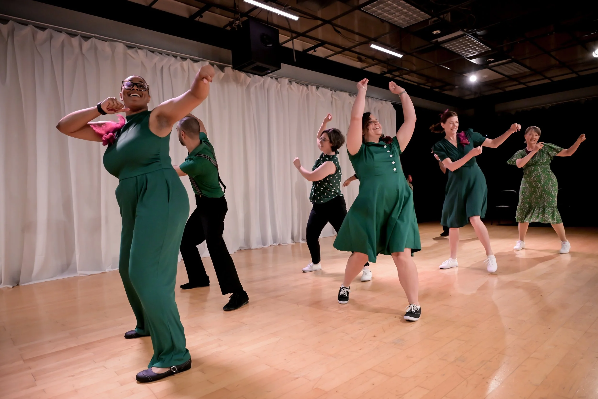 dancers in green performing