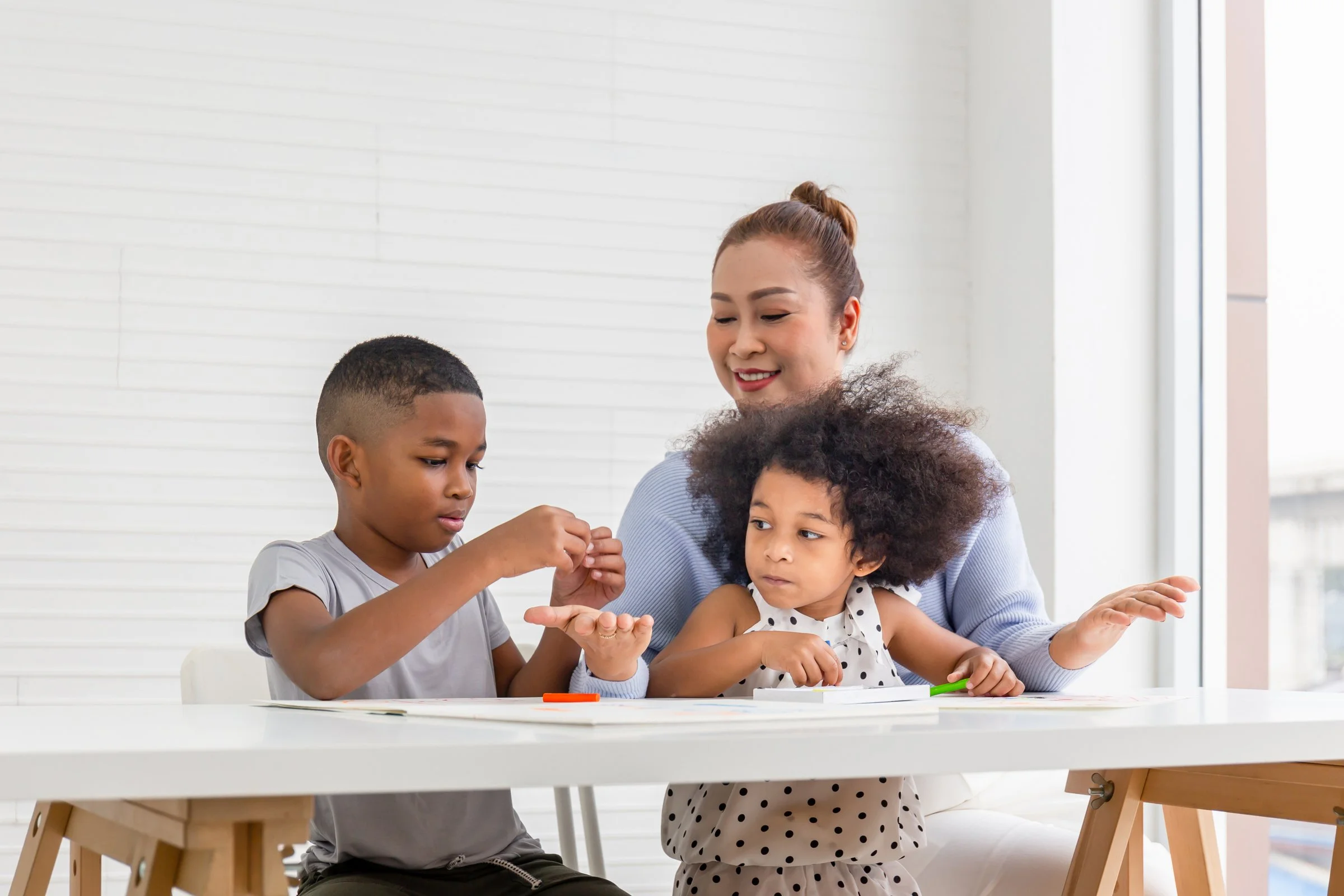 nanny engaging child in educational play at home