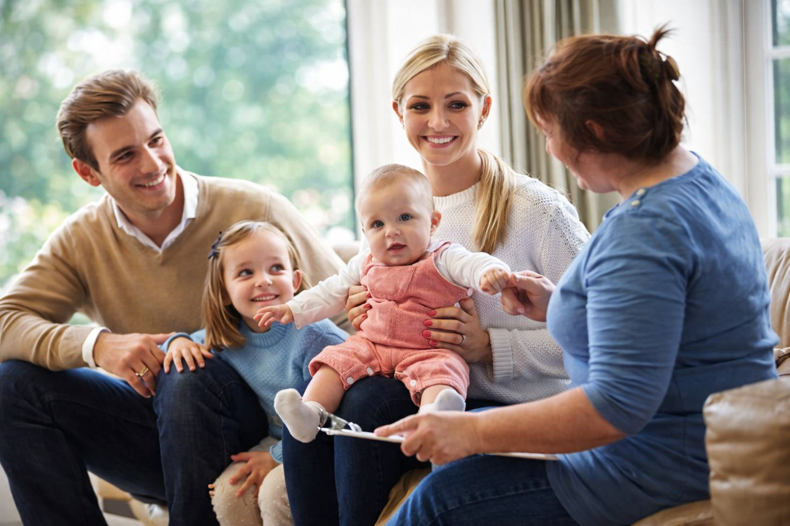 Parent introducing child to a new nanny in a calm home environment