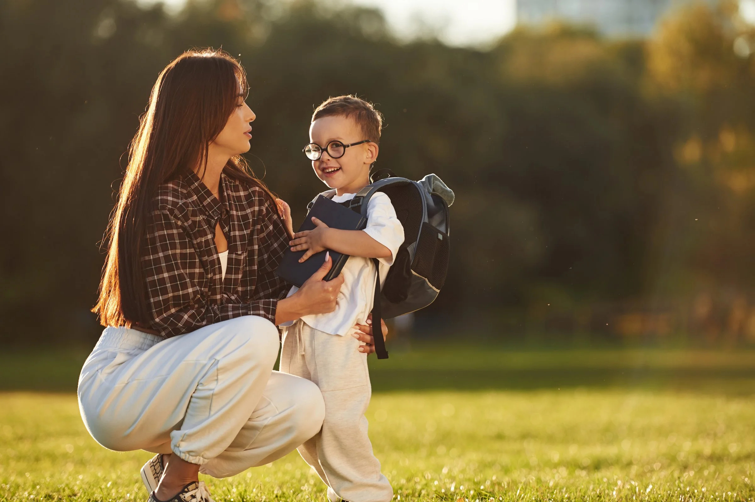 Child leaving school in Boston at the end of the school year with parent