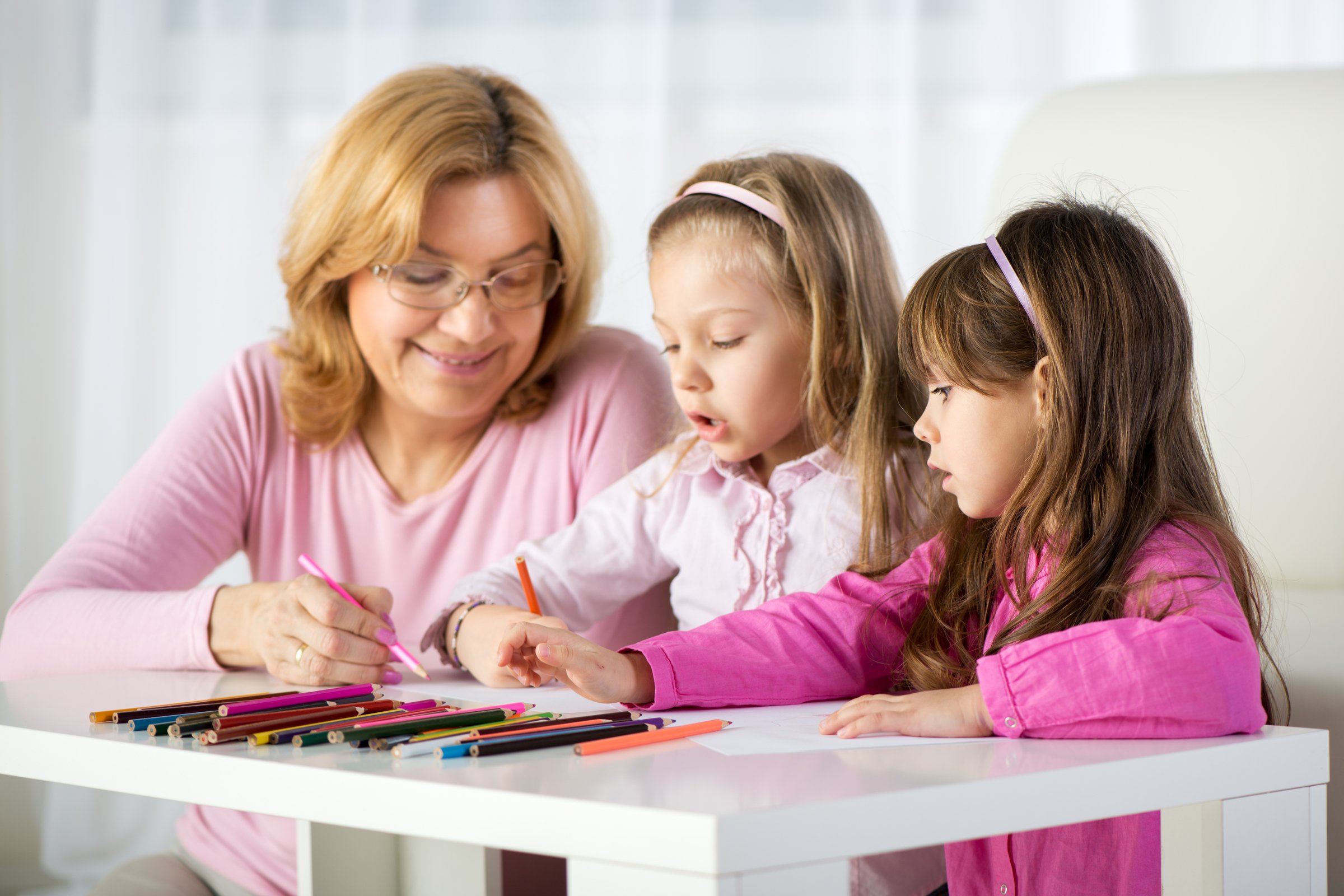 Experienced career nanny leading educational activity with children in Mason Ohio home