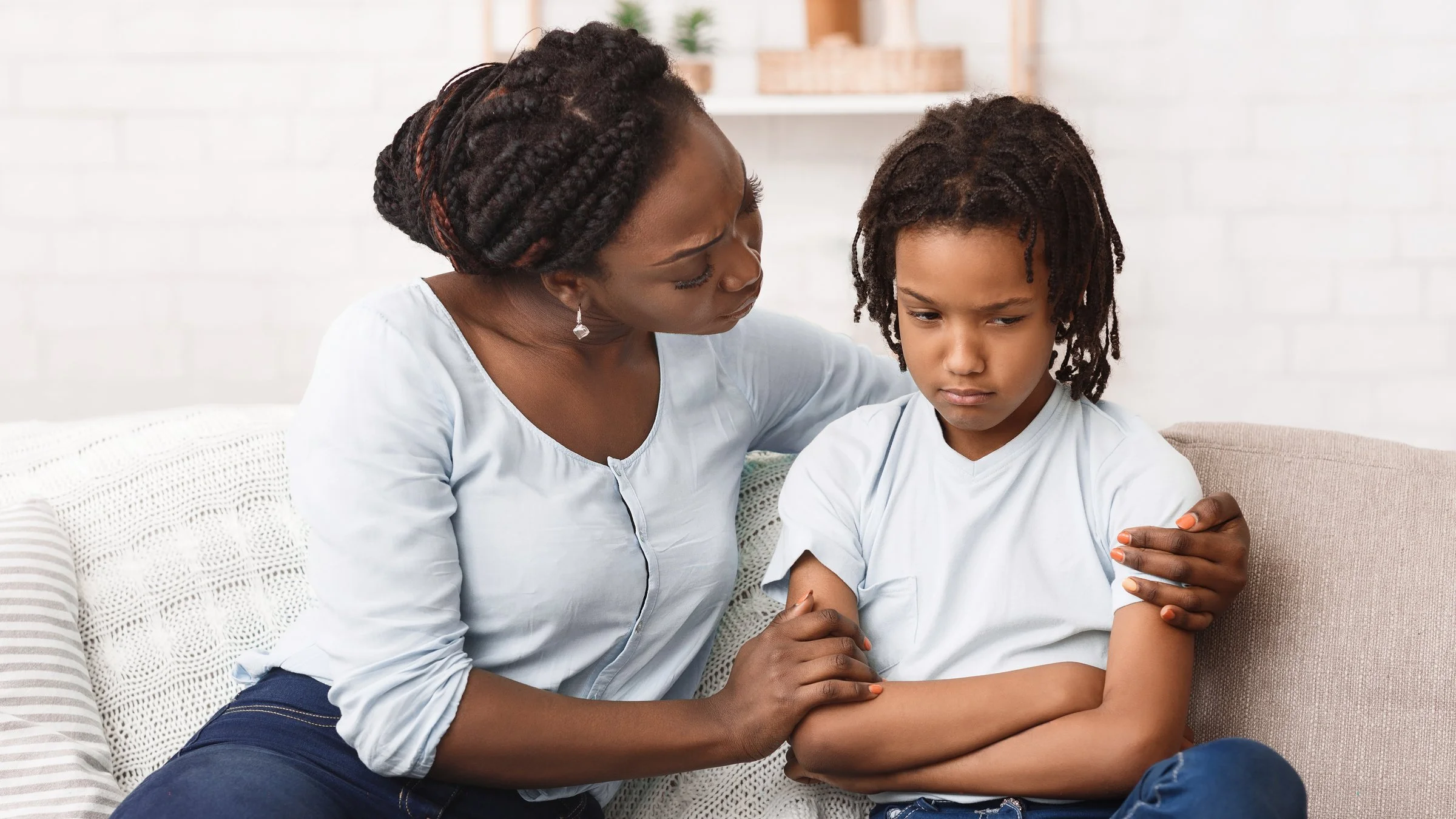 parent calmly trying to communicate with child during a moment of not listening