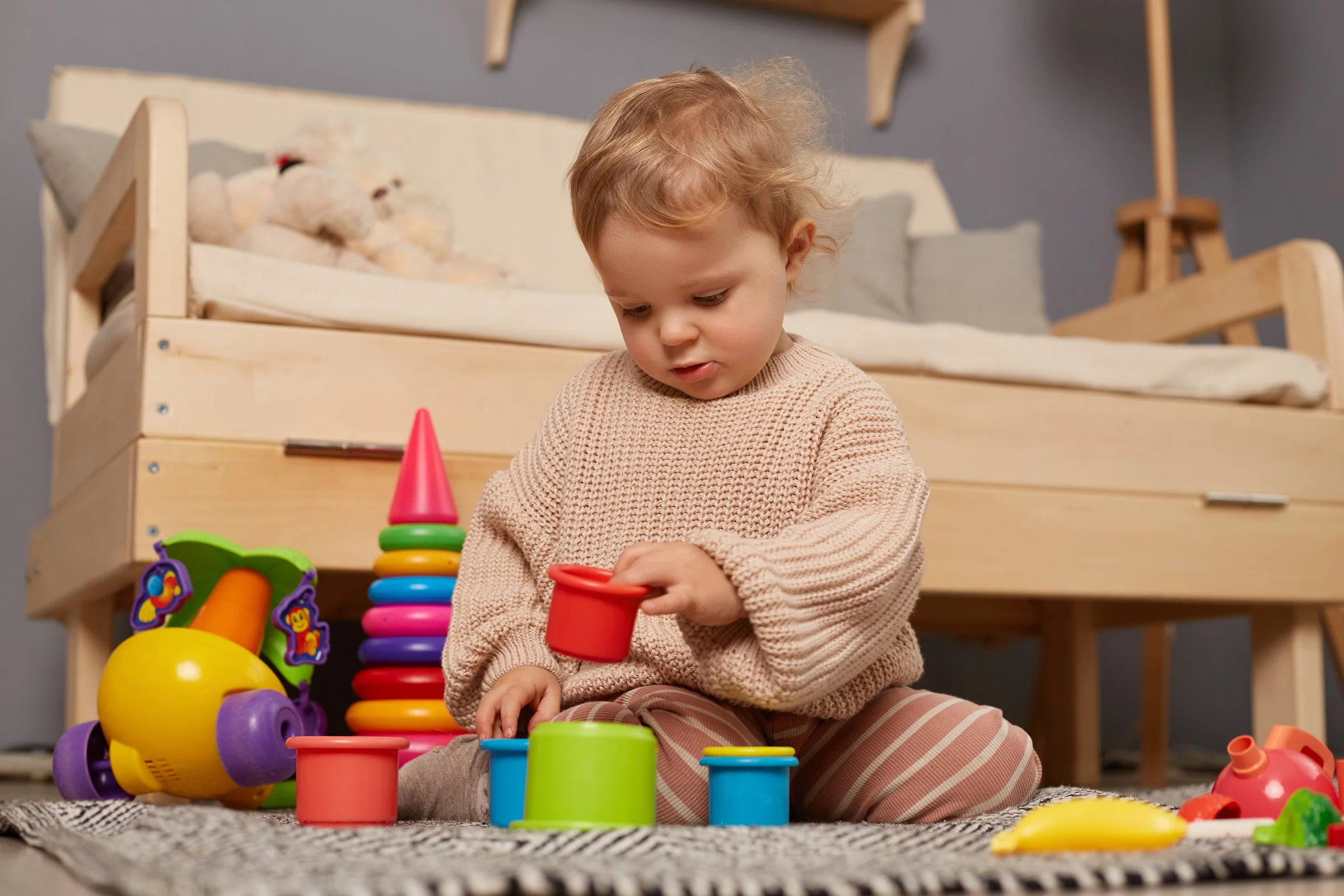 Young child enjoying independent imaginative play without screens or structured activities