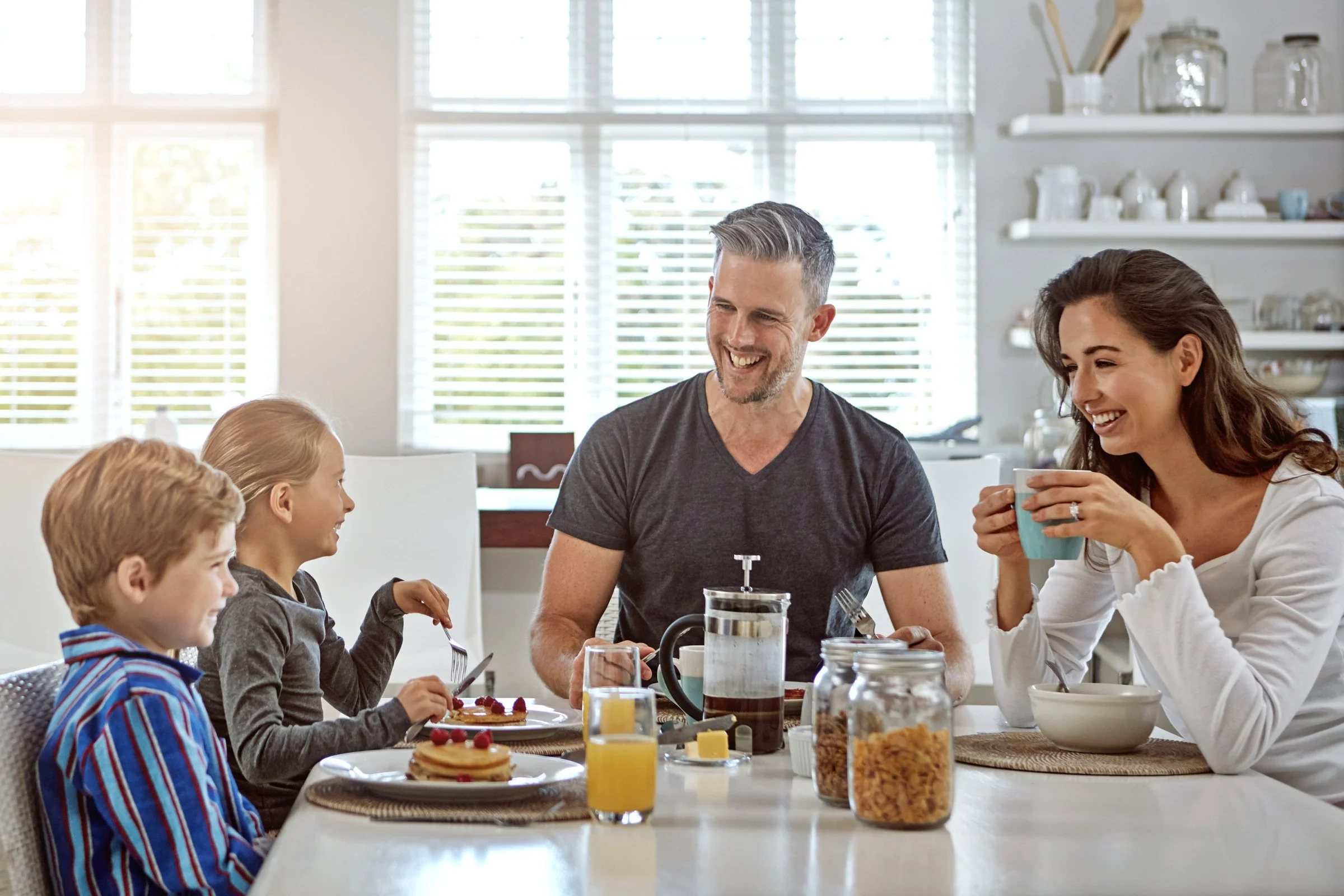 Family enjoying a cheerful Mother’s Day breakfast together