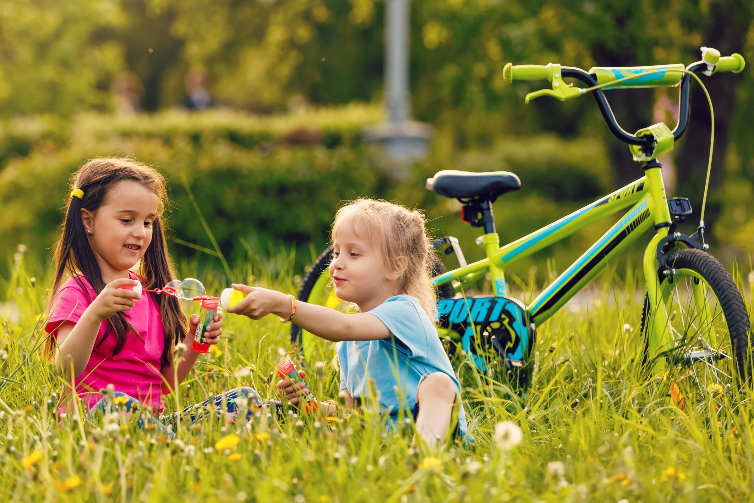 Children playing outside during a screen-free summer day in Boston