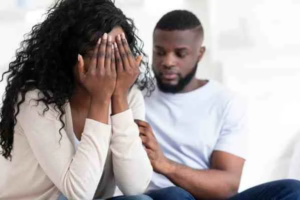 A man comforting his partner as they begin healing together after betrayal