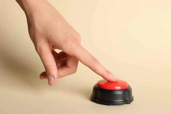 hand pushing reset button