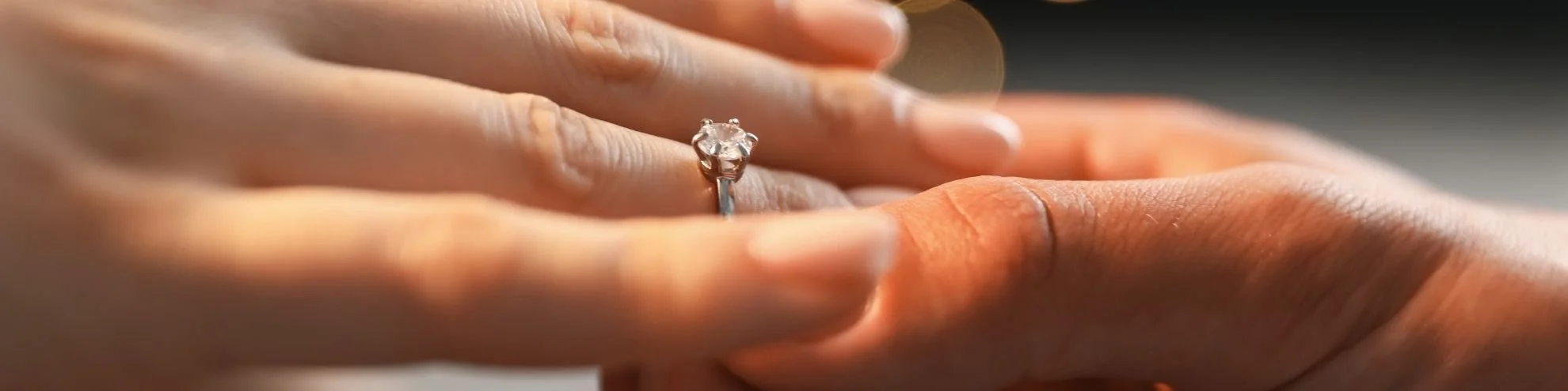 A close-up of a couple's hands with a wedding ring — marriage counseling at Insights Counseling Center