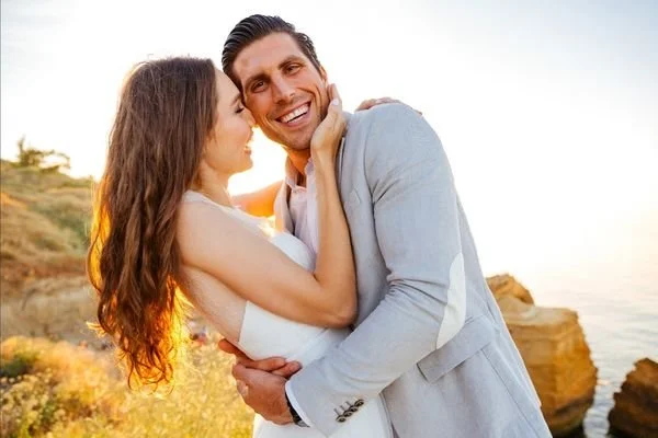 A young couple embracing outdoors at sunset — premarital counseling at Insights Counseling Center in Birmingham, AL.