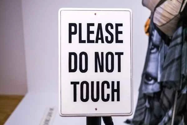 sign saying please do not touch