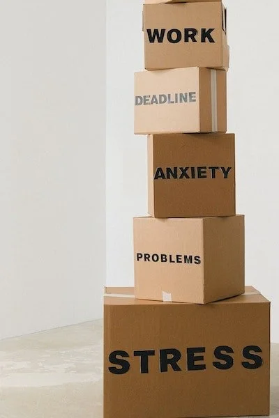 pile of boxes with issues of work stress anxiety problems for couples