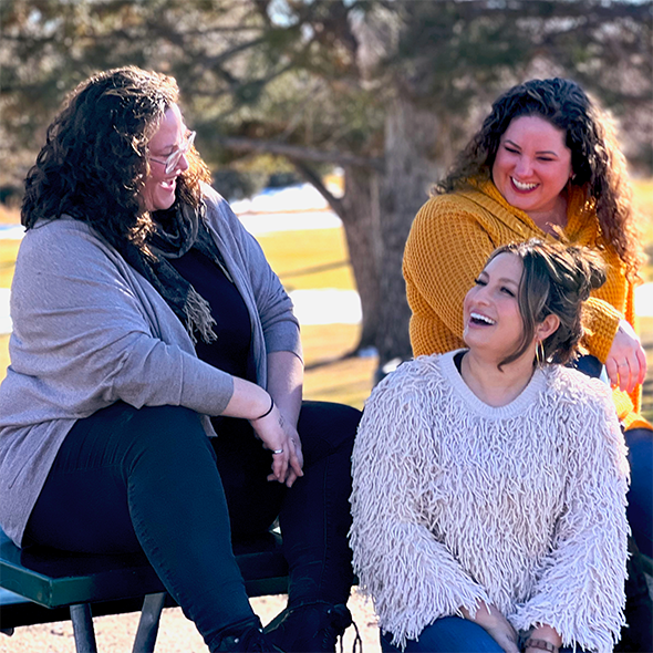 UWFC's three remaining founders laughing during a photoshoot