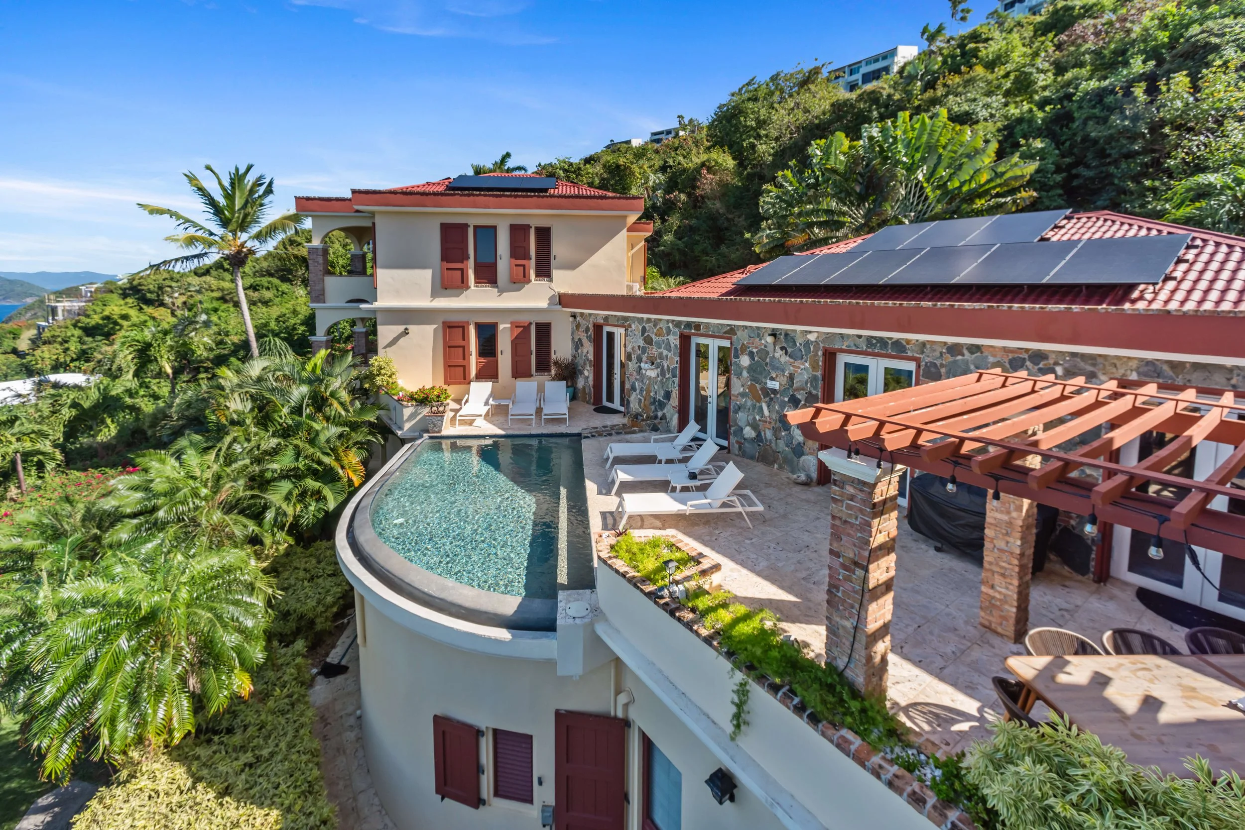 Birds Eye view of the infinity pool, main house and suites 1 & 2. 