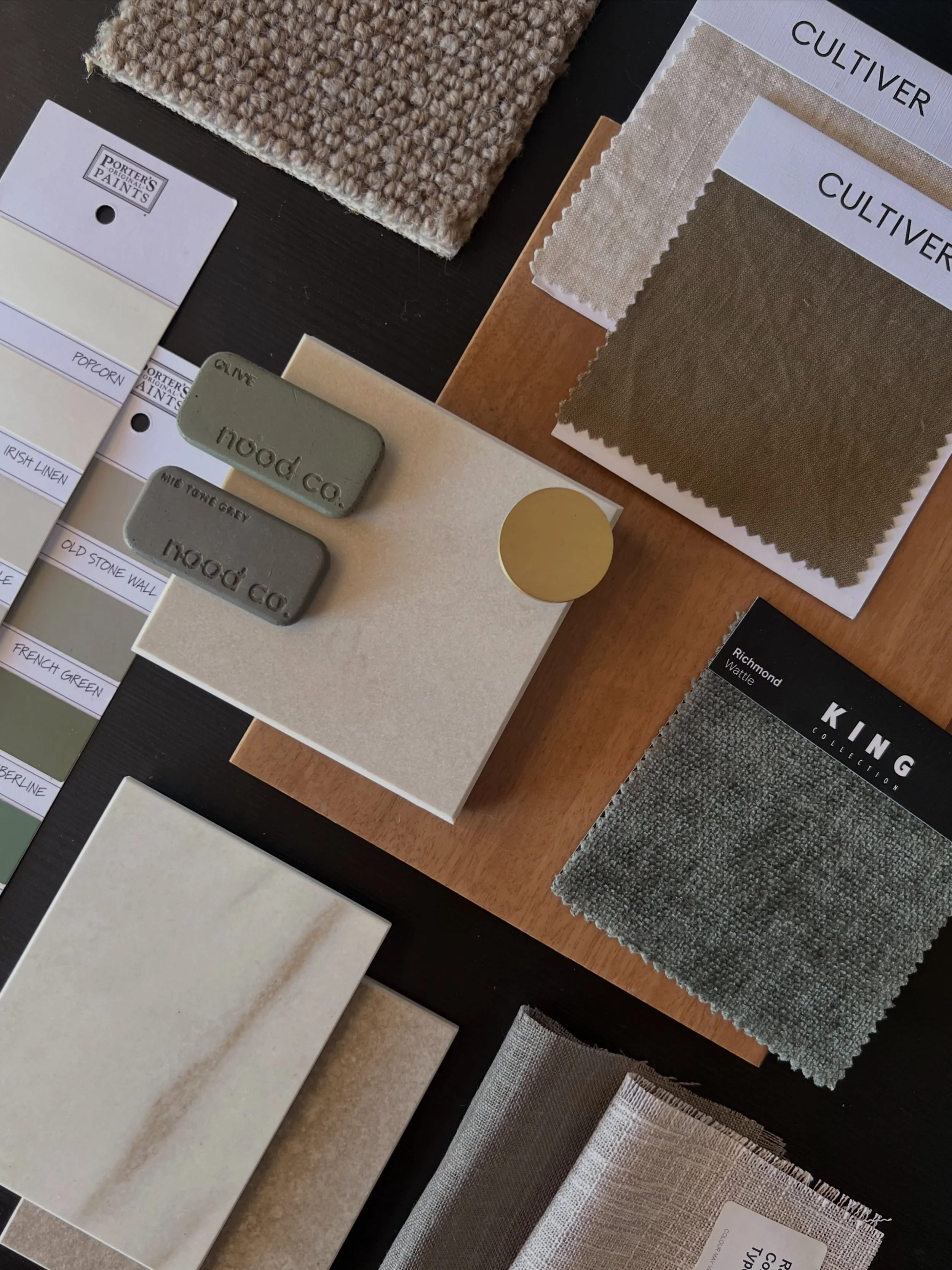 Flat lay: muted greens, warm timber and soft neutrals.

This palette is built around earthy colour and plenty of variation in texture. The timber brings warmth, the greens add depth, and the pale stone and linen keep the overall feel soft and balance