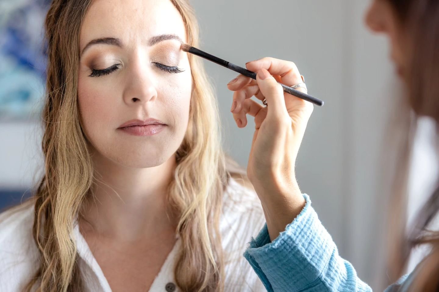 I can't say I have ever had my make up done by my sister but it seems like it's a lot of fun. 

I love it when a sibling or bridesmaids is willing to jump in for the make up shots of the bride on a wedding day. It's makes for some fun silly laughs an