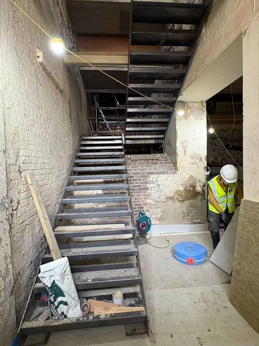 4 flight staircase fabricated and installed in central London. The treads and landings are now ready to take the concrete pour.