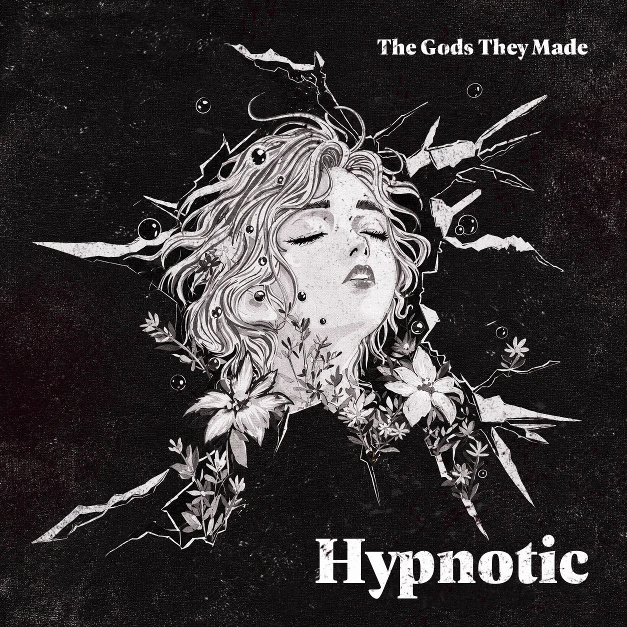 Black and white artistic illustration of a woman with closed eyes and flowing hair surrounded by flowers, with the text "The Gods They Made" at the top right and "Hypnotic" at the bottom right.