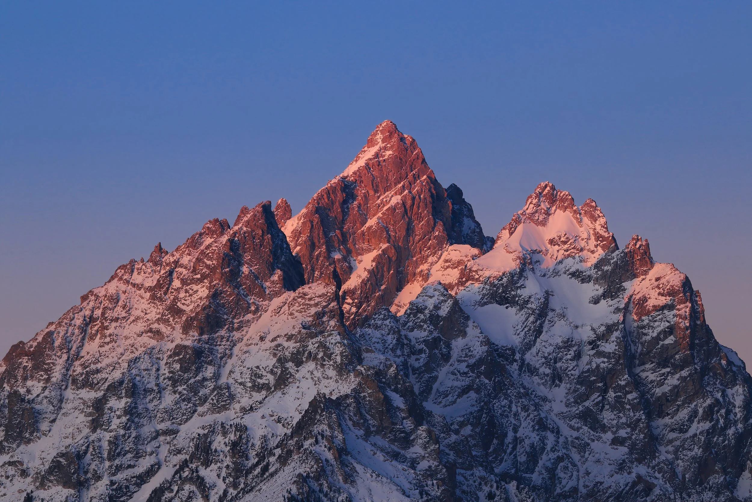 Soft morning glow on mountain peaks in Grand Teton National Park, WY