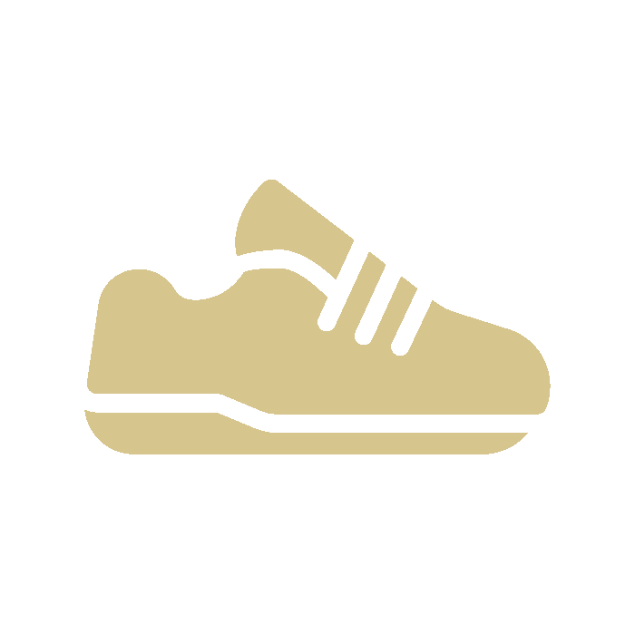 Icon of a beige sneaker with black accents and laces on a black background.