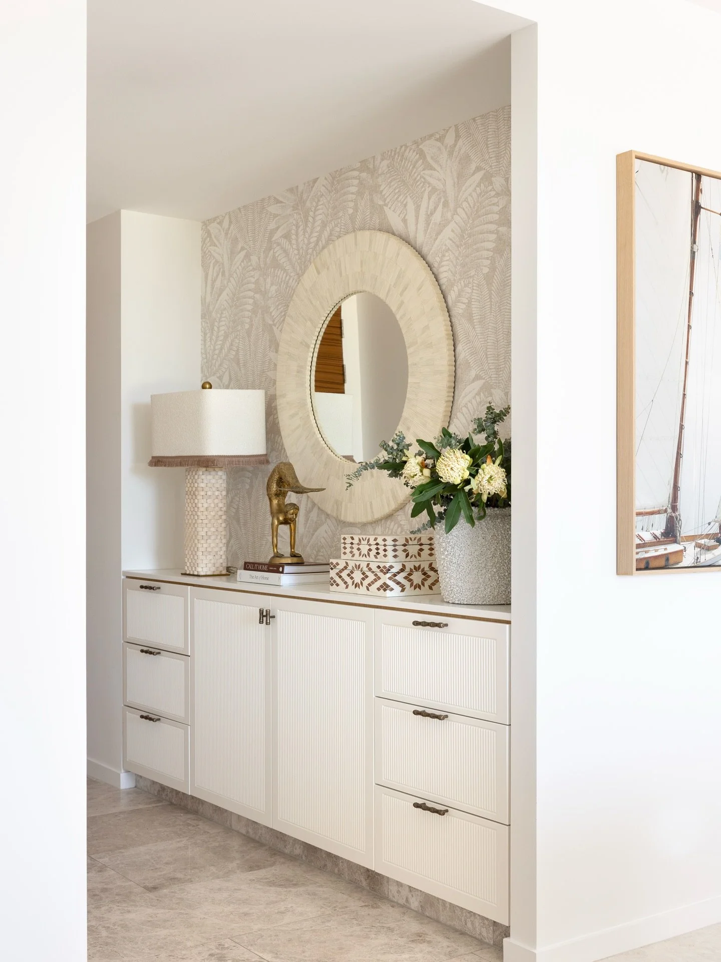 Entry || Creating a dreamy entry with updated cabinetry with the perfect bamboo handles, tonal botanical wallpaper, a textural bone inlay mirror, the most epic woven stone lamp with custom shade and just the right accessories. Welcome to Mali 🤎