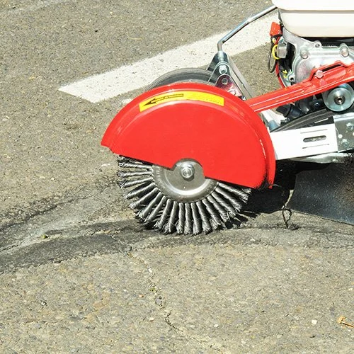 Asphalt parking lot crack cleaning