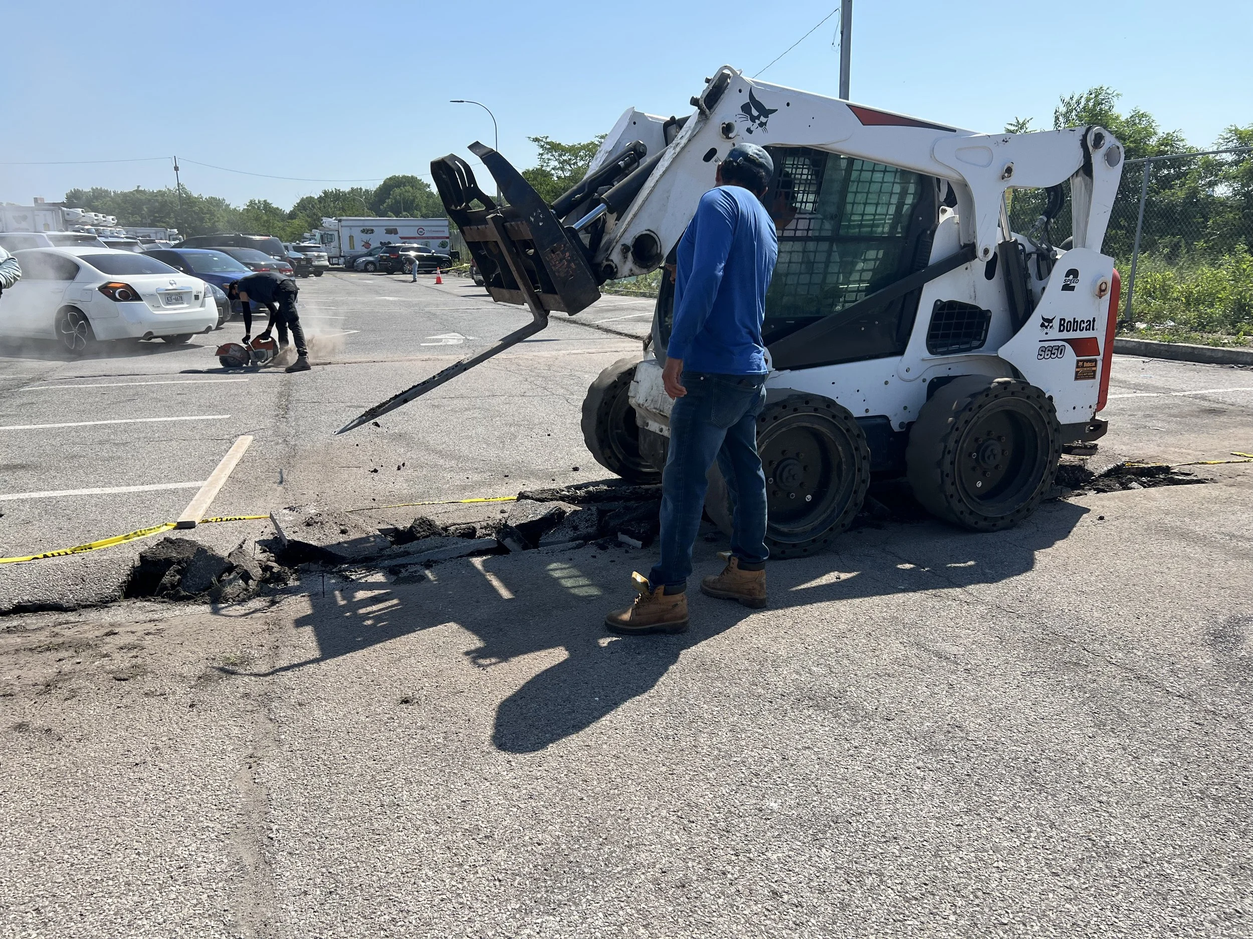 Repairing potholes on a parking lot on Long Island, NY