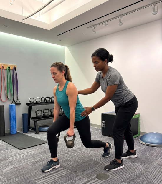 Patient working with a provider at a performance physical therapy clinic in Arlington