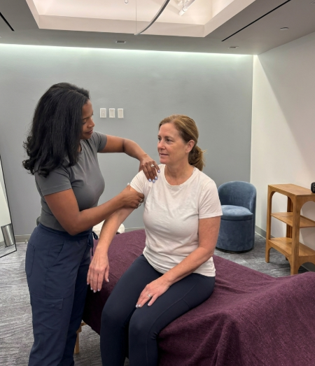 Patient working with a provider at a performance physical therapy clinic in Arlington, VA during a hands-on manual therapy screening