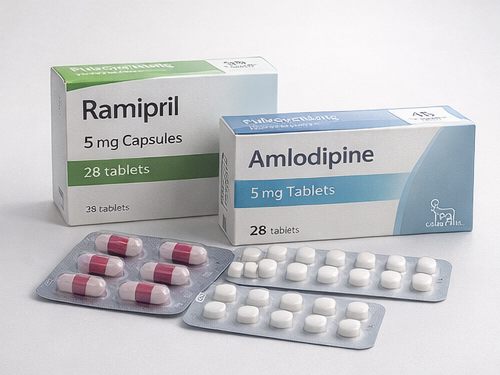 Two boxes of medication, one labeled Ramipril and the other labeled Amlodipine, with blister packs of capsules and tablets in front.
