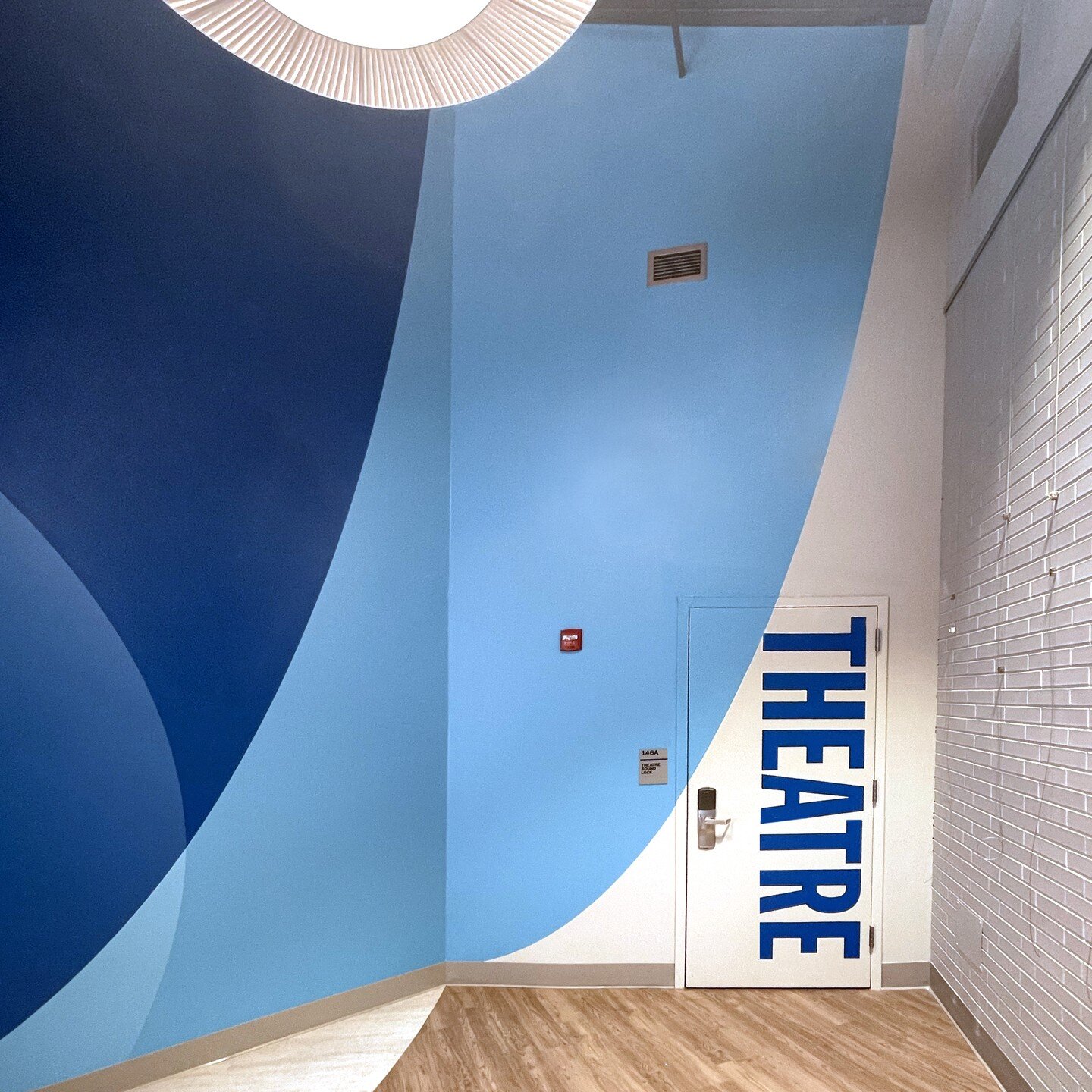 The Bishop Dougherty University Center at Seton Hall University has some new murals by TGO. The wavy checkered pattern is from a university flag and represents the rivers of New Jersey. #muraldesign #universitygraphicsystems #architecturalgraphicdesi
