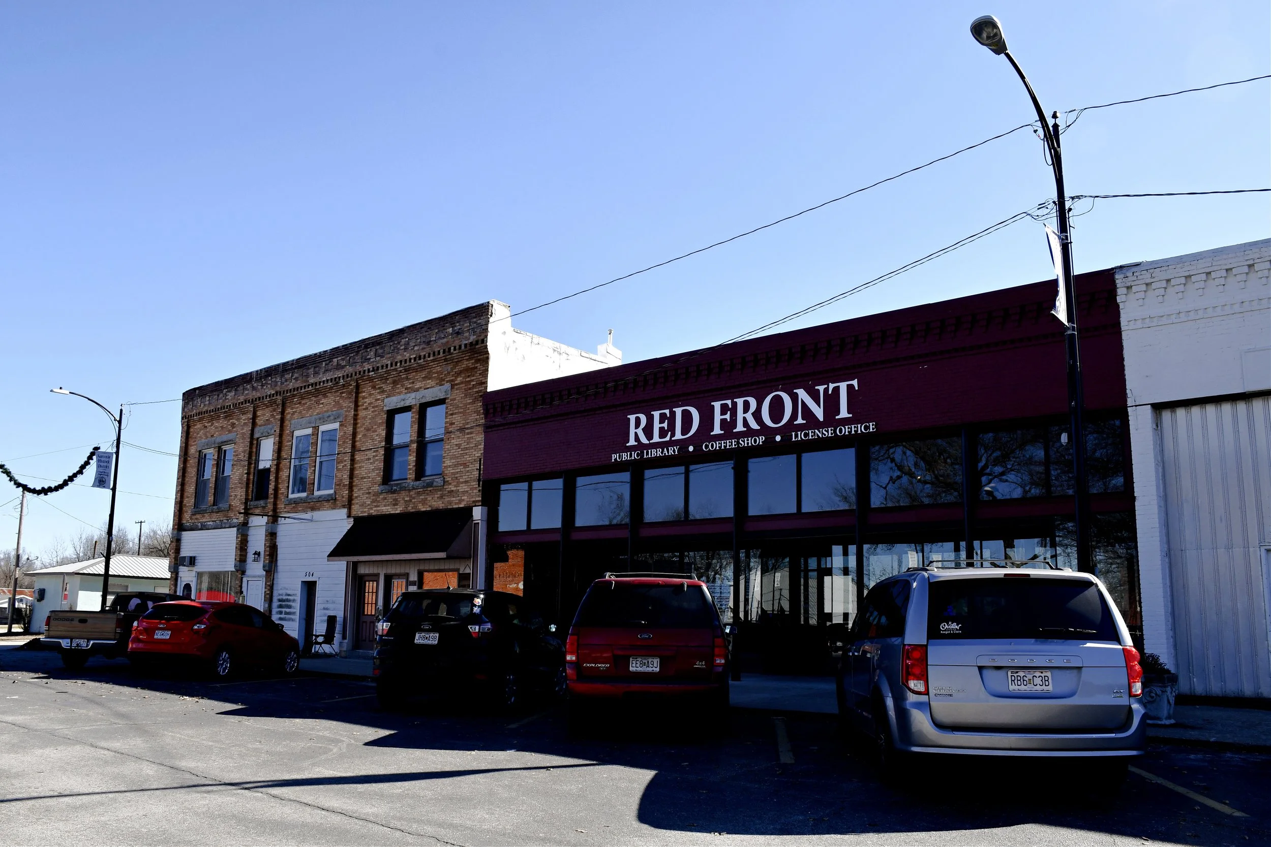 New coffee shop + library + license office creates community hub in