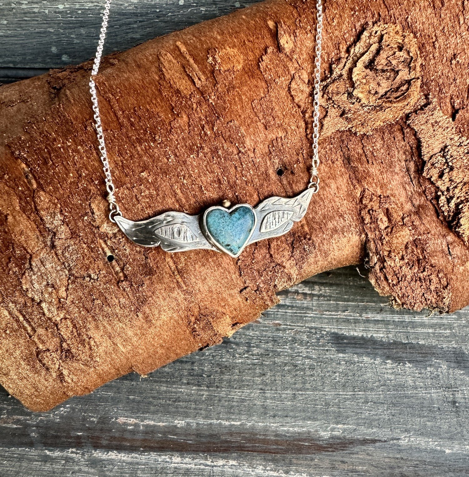 Small Turquoise Winged Heart with Gold.jpeg