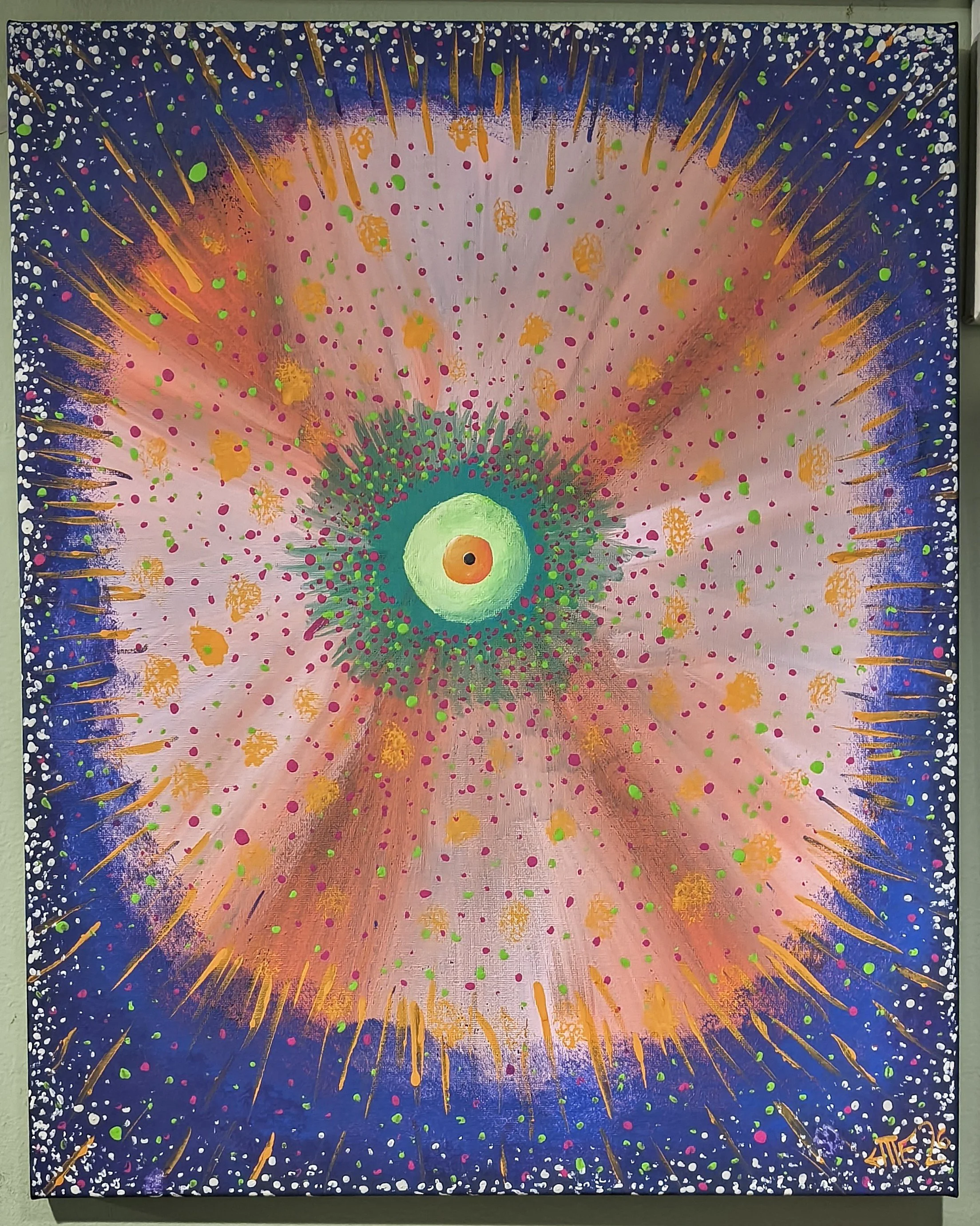 Abstract painting with a central green and yellow orb surrounded by multicolored dots and streaks, creating a starburst or explosion effect, with dark blue and purple border dotted with white and multicolored dots.