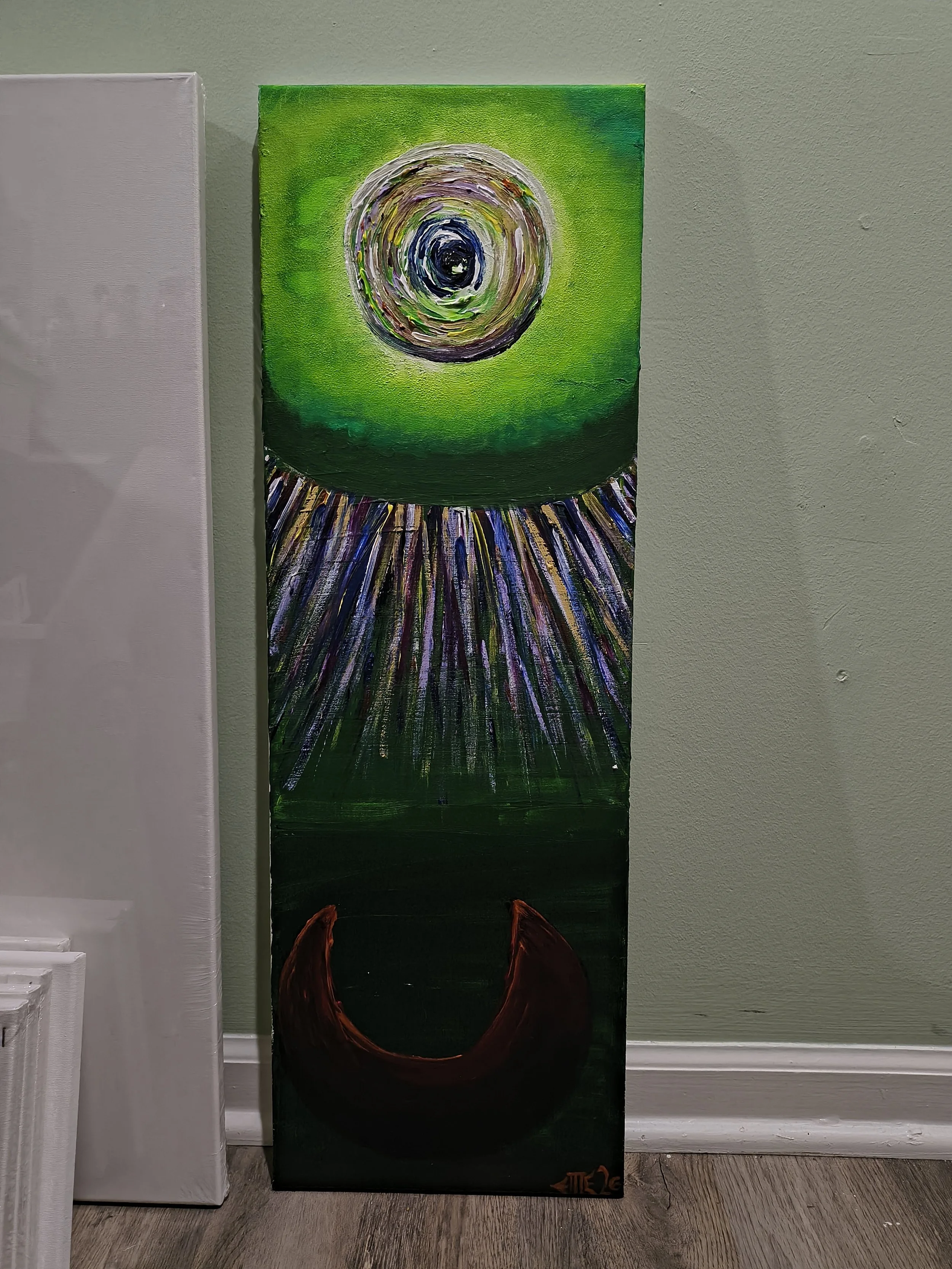 An abstract painting on a tall, rectangular canvas. The top features a swirling, circular pattern in shades of white, gray, and black with a green background. Below, purple, blue, and yellow streaks radiate downward against a green background, ending