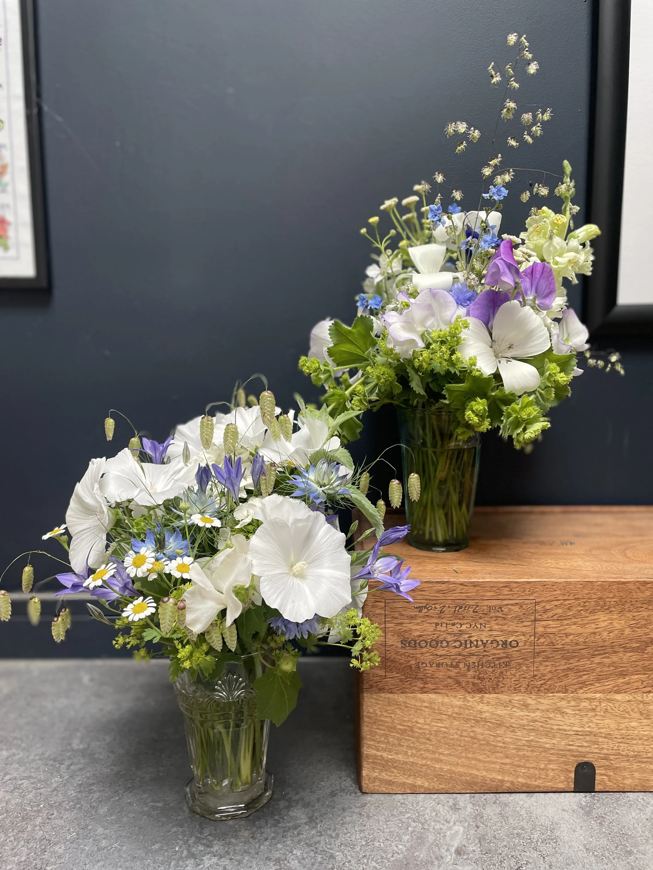 Graveside flowers in glass vases with white blooms and purple bellflower from Blue Hill Flora